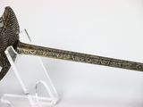 an old sword with a metal handle on a clear stand