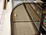 a glass display case in the middle of a store