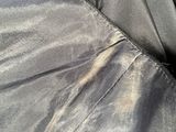 a close up of a person ' s pants and jacket