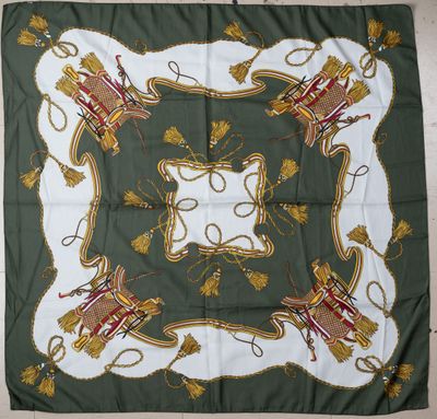 a green and white square scarf with a picture of a castle