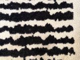 an image of a black and white rug with an american flag on it