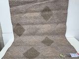 a chair that has a blanket on top of it