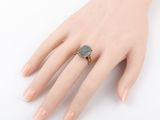an image of a woman ' s hand with a ring on it ' s finger