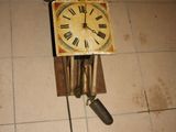 a clock that is on the floor on the floor