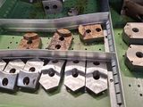 many pieces of metal that are on a table