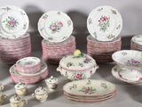 a lot of plates and bowls that are on a table