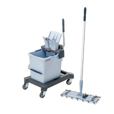 a close up of a mop and bucket on a cart