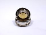 an image of a close up of a silver ring with a banana in it