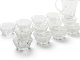 a lot of glasses and a pitcher on the table