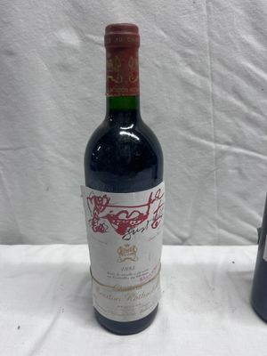 two bottles of wine sitting next to each other on a table
