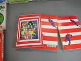 two books on the table and one has a spider - man on it