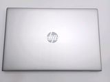 a laptop with a hp logo on the screen
