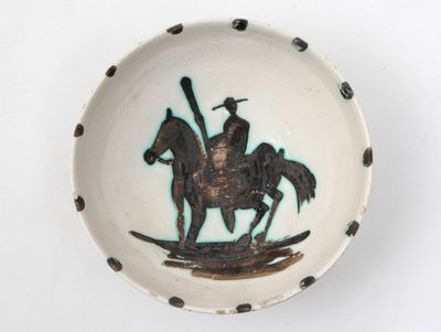 a bowl with a picture of a man on a horse on it