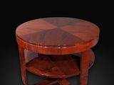 une table basse Art déco avec un plateau circulaire en bois