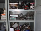 a cabinet with many items on it in a room
