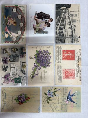 many different types of postcards on the table