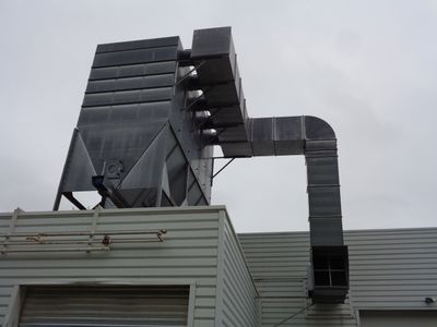 a large metal structure on the roof of a building