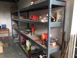 many shelves with various tools on them in a garage