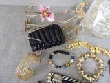 many different types of jewelry on the table