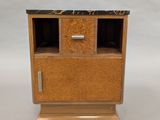an image of a small wooden cabinet with a marble top