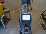 a machine that is sitting on the floor in the garage