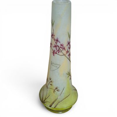 a glass vase with a floral design on it