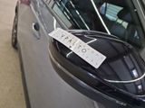 a sticker on the side mirror of a car