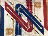 flag with musical instruments on it on a wooden floor