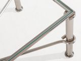 a glass table with a metal frame and a glass top