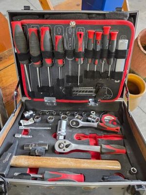 a tool case with tools in it sitting on a table