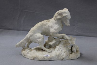 a statue of a dog that is on a rock