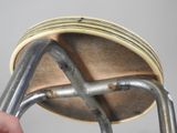a person that is holding a metal object in their hand