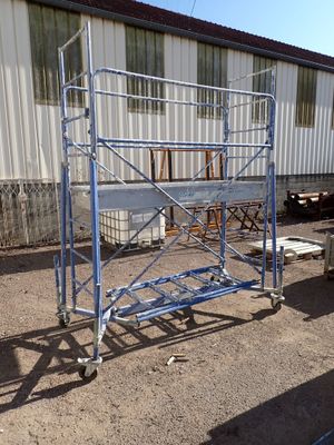 a picture of a blue scaffolding in front of a building