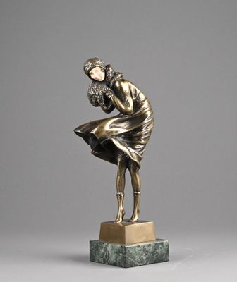 bronze statue of a woman holding a bird on a marble base
