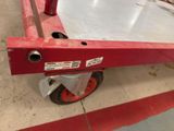an image of a dolly with a red handle on it