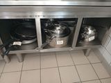 pots and pans that are sitting on the counter