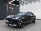 a black suv parked in a showroom with a red sign above it