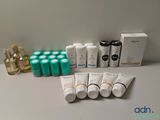 many bottles of different types of skin care products on the table