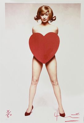 an image of a woman holding a red heart in her right hand