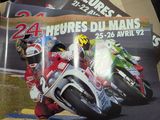 a poster of a motorcycle racing event on a table