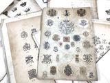 a lot of old papers that are laying on a table