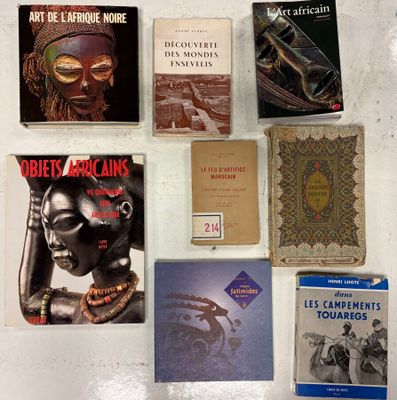 several books are laid out on a white surface