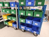 many green and blue bins on the shelves in the room