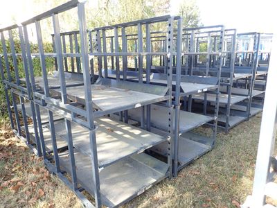 a lot of shelves that are sitting in the grass