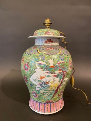 an image of a colorful vase with a lid on a table