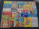 many children ' s books laid out on a table