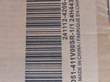 a brown box with a barcode on it sitting on a table