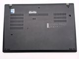 a black laptop that is sitting on a white surface