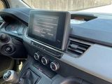 the dashboard of a car with a car radio and a steering wheel