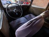 a view of a car from the driver ' s seat